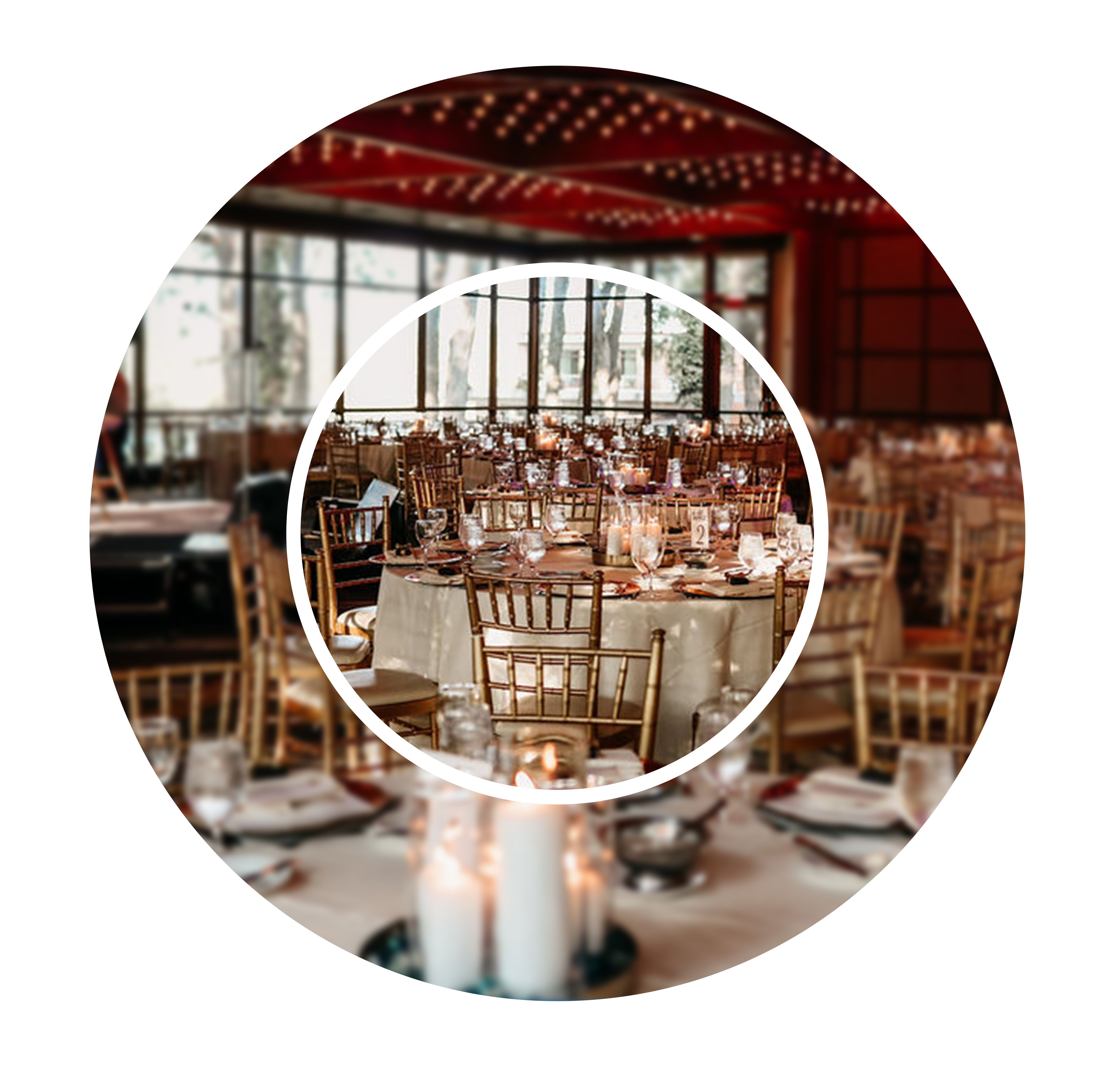 Elegant banquet hall with round tables set for an event. Candle centerpieces and dim lighting create a warm, inviting atmosphere. Gold chairs add a touch of luxury.